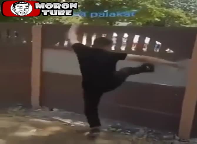 Video :With a single kick, he destroys a wall, and karma handles the rest